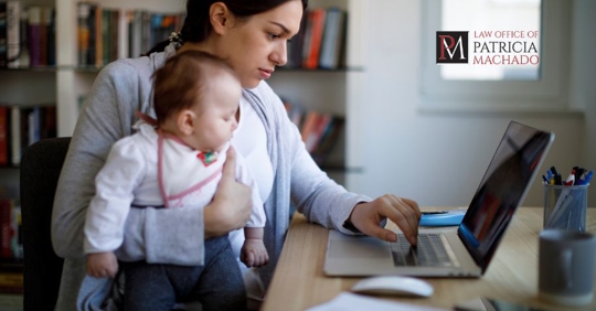 mother and child looking at laptop