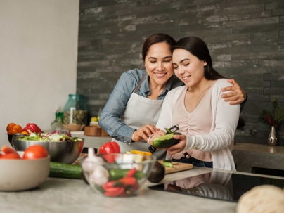 mother and daughter cooking