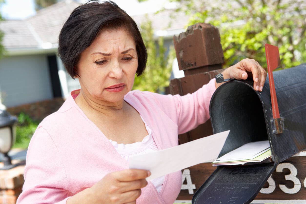 woman looking at mail