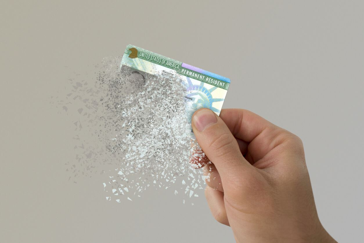 person holding visa as it disappears