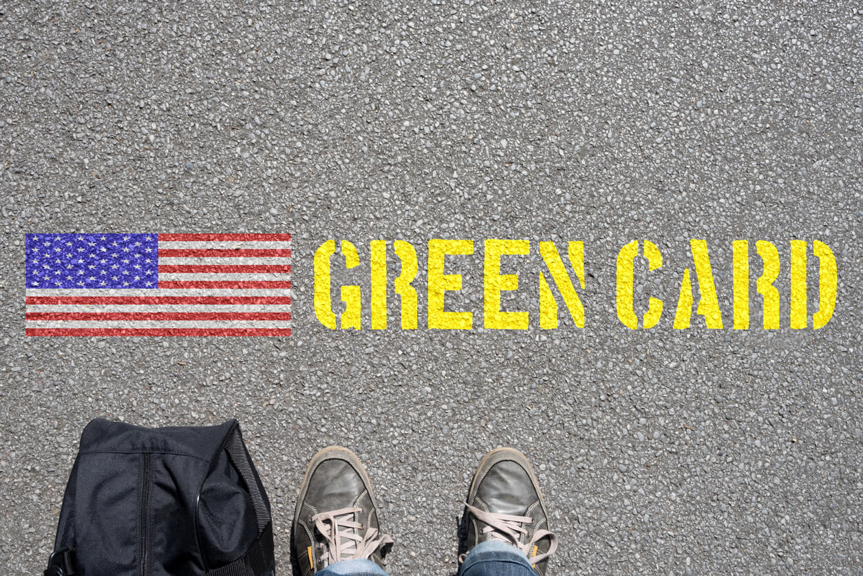 green card spray painted on street floor